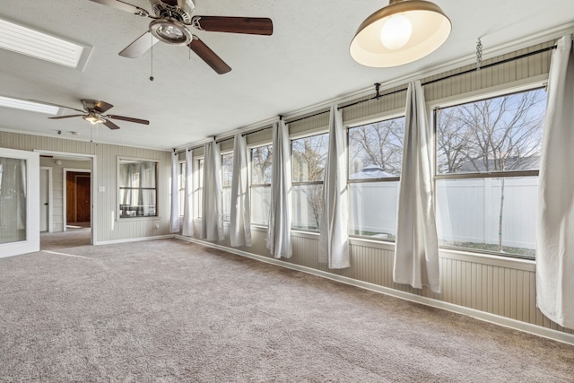 interior space with ceiling fan