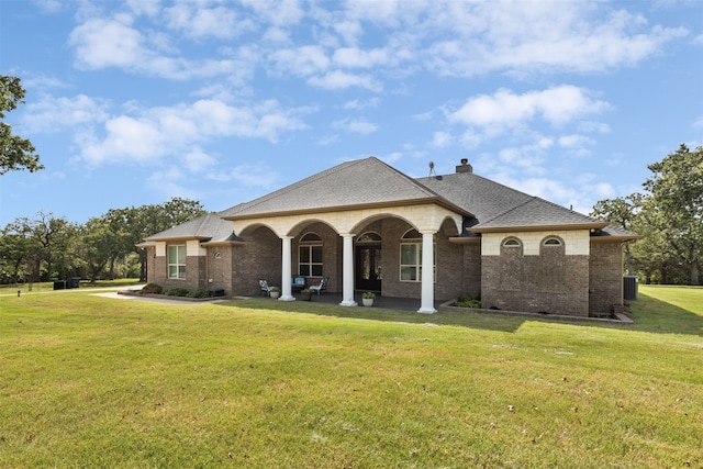 view of front of property with a front lawn and cooling unit