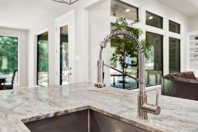 kitchen featuring light stone countertops