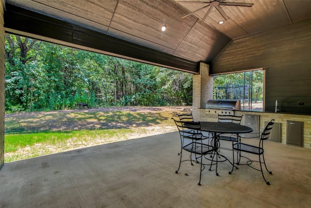 view of patio with a sink, grilling area, exterior kitchen, and outdoor dining space