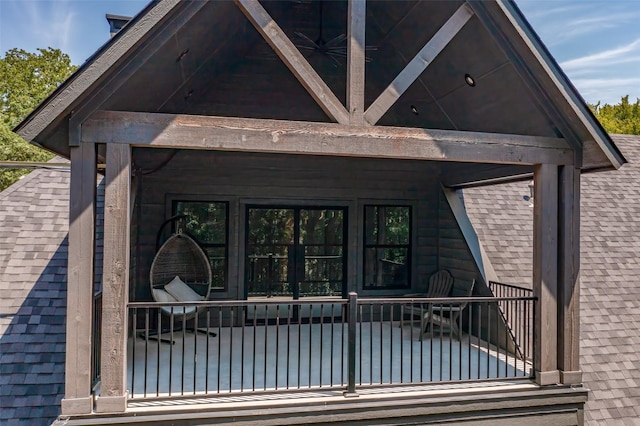 property entrance with roof with shingles