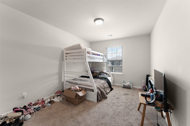 bedroom with light colored carpet