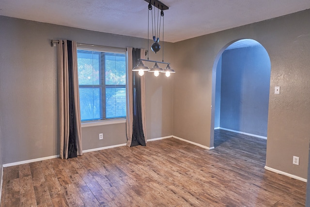 spare room featuring hardwood / wood-style floors