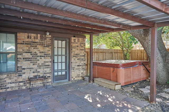 view of patio with a hot tub