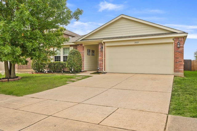 view of front facade with a garage, brick siding, driveway, and a front lawn