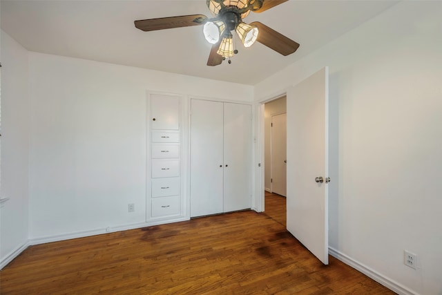 unfurnished bedroom featuring hardwood / wood-style flooring and ceiling fan