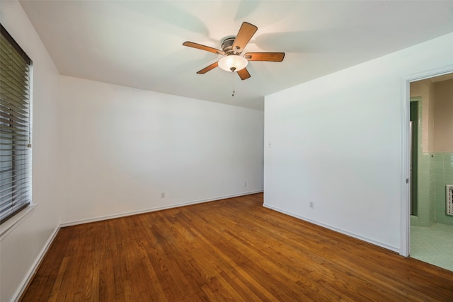 unfurnished room featuring hardwood / wood-style flooring and ceiling fan