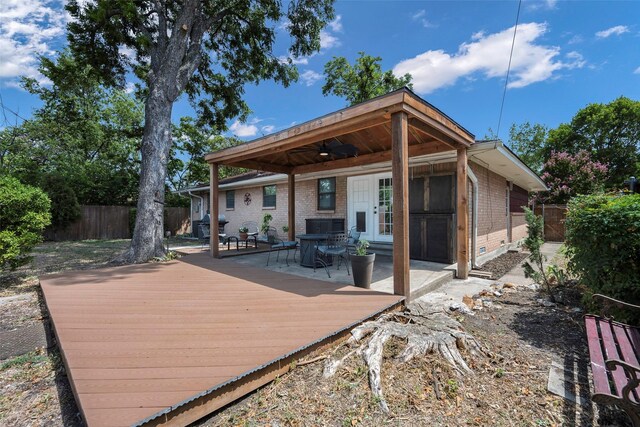 rear view of house with a wooden deck