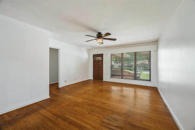 empty room featuring ceiling fan and hardwood / wood-style floors