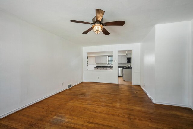 unfurnished living room featuring wood-type flooring and ceiling fan