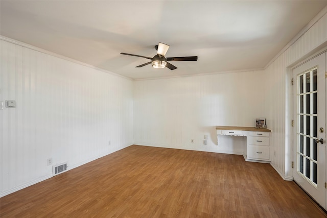 spare room featuring crown molding, french doors, ceiling fan, and wood-type flooring