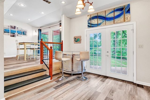 entryway with french doors and hardwood / wood-style floors