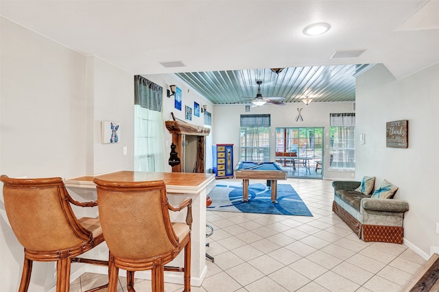 tiled dining space featuring pool table and ceiling fan