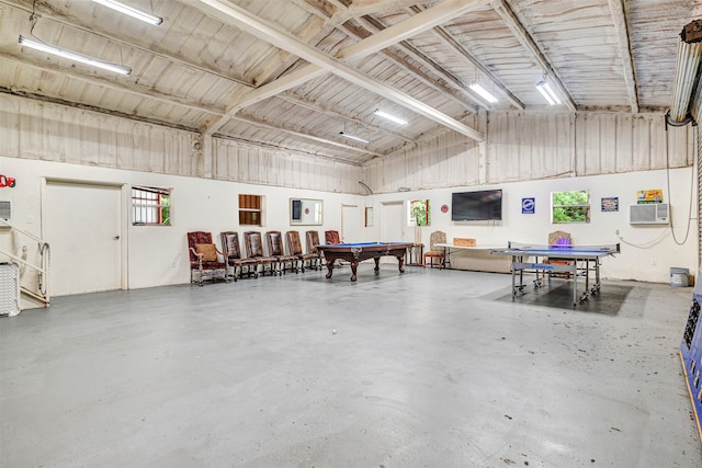 garage featuring a wall mounted air conditioner