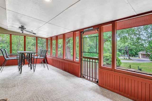 sunroom featuring plenty of natural light and ceiling fan