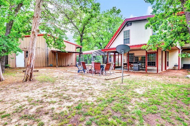 view of yard featuring a patio area and central air condition unit