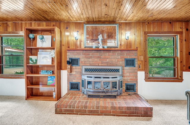 living room with wooden ceiling and wooden walls