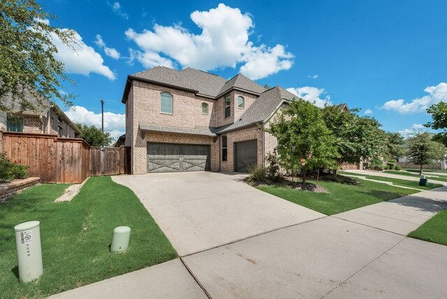 view of front facade with a garage and a front yard