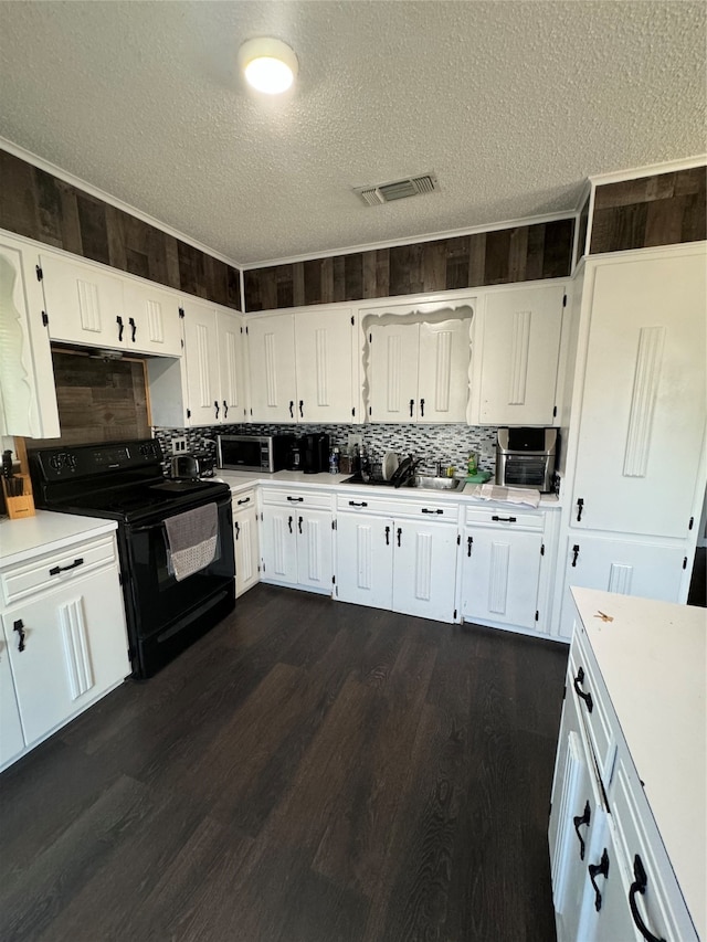 kitchen with tasteful backsplash, a textured ceiling, white cabinets, black range with electric cooktop, and dark hardwood / wood-style floors