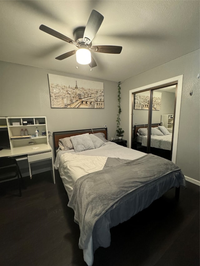 bedroom with ceiling fan and hardwood / wood-style floors