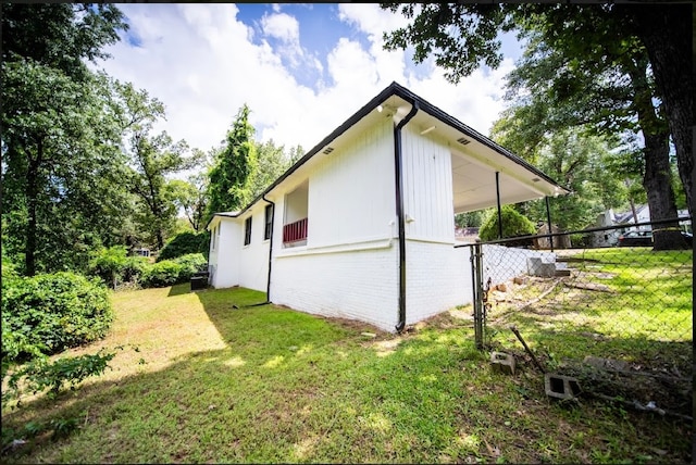 view of home's exterior featuring a lawn