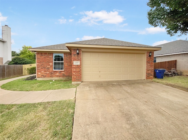 view of front of property featuring a garage and a front lawn