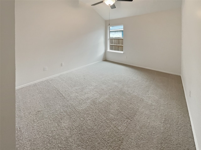 unfurnished room featuring vaulted ceiling, ceiling fan, and carpet flooring