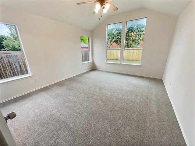 spare room with carpet, lofted ceiling, and ceiling fan