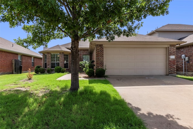 ranch-style house featuring a front lawn and a garage