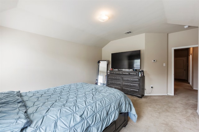 bedroom with light carpet and vaulted ceiling