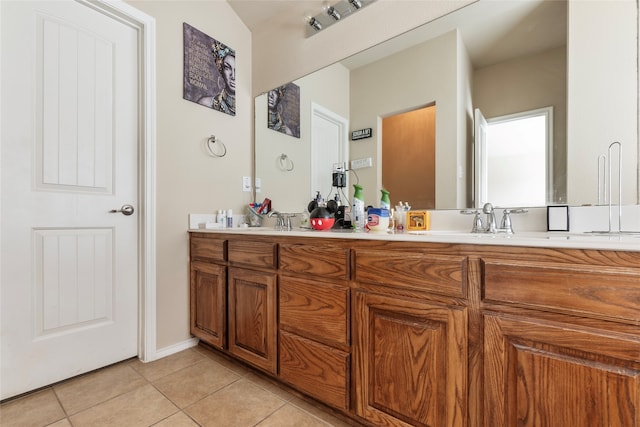 bathroom featuring tile patterned flooring and vanity