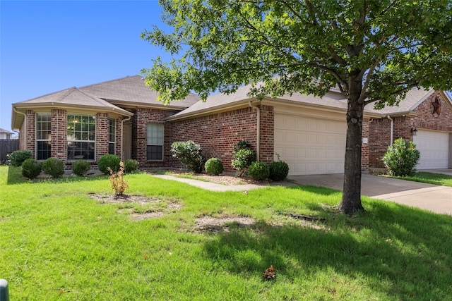 ranch-style home with a front yard and a garage