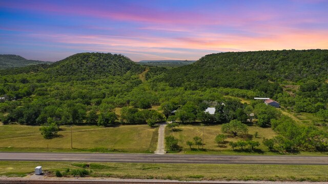 property view of mountains featuring a rural view