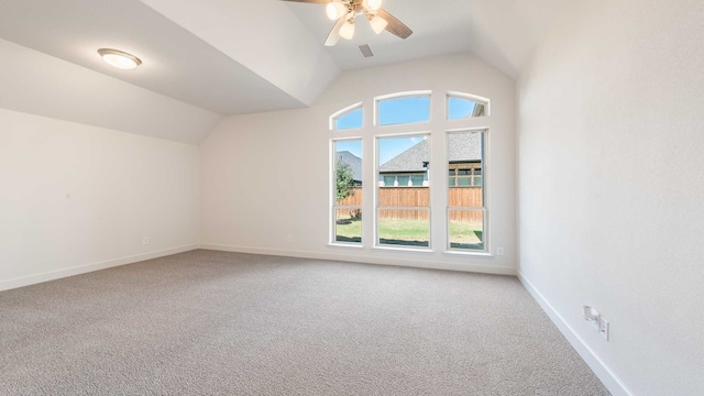 bonus room with ceiling fan, vaulted ceiling, and carpet