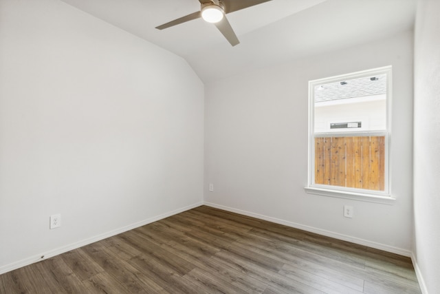 spare room with hardwood / wood-style flooring, ceiling fan, and vaulted ceiling