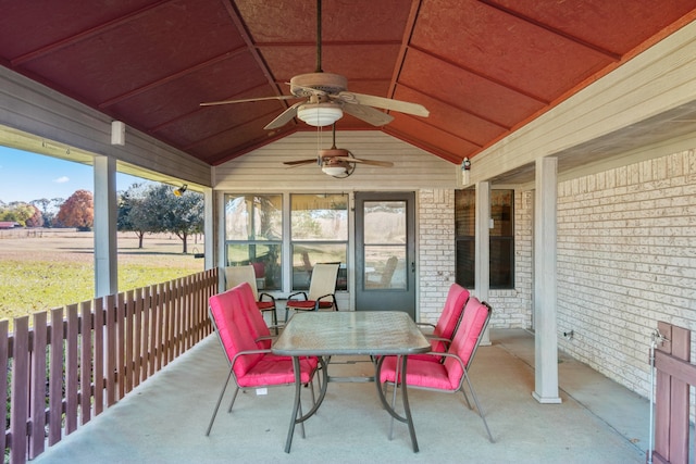 sunroom / solarium with wood ceiling, ceiling fan, and lofted ceiling