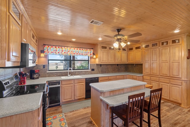 kitchen with light hardwood / wood-style floors, black appliances, and wood ceiling