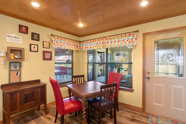 dining area featuring wooden ceiling, hardwood / wood-style flooring, and ornamental molding