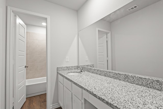 bathroom with vanity and hardwood / wood-style flooring