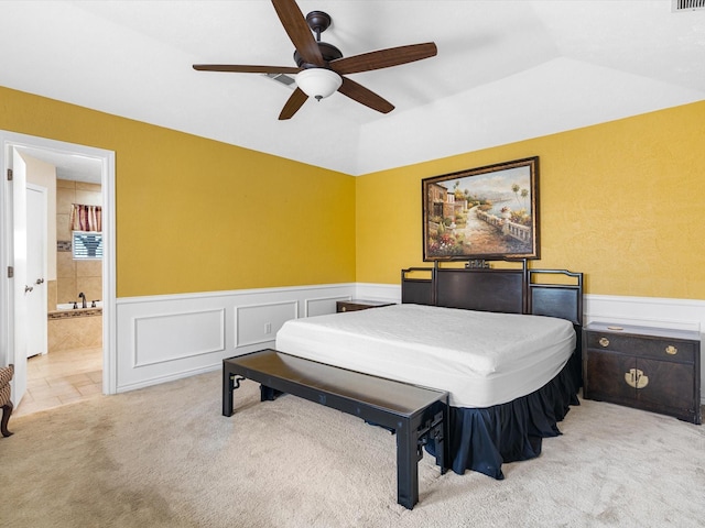 carpeted bedroom featuring connected bathroom, ceiling fan, and lofted ceiling