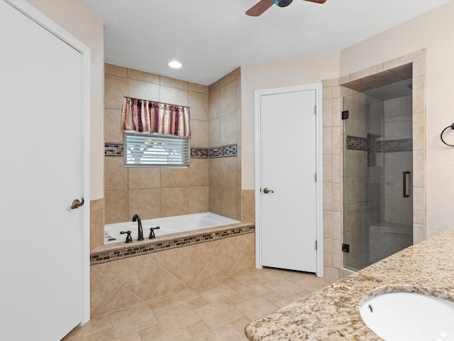 bathroom with shower with separate bathtub, sink, ceiling fan, and tile patterned floors