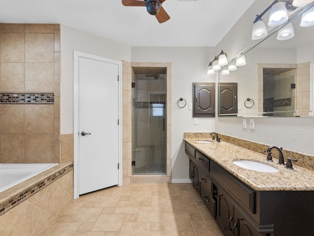 bathroom with tile patterned flooring, separate shower and tub, dual vanity, and ceiling fan