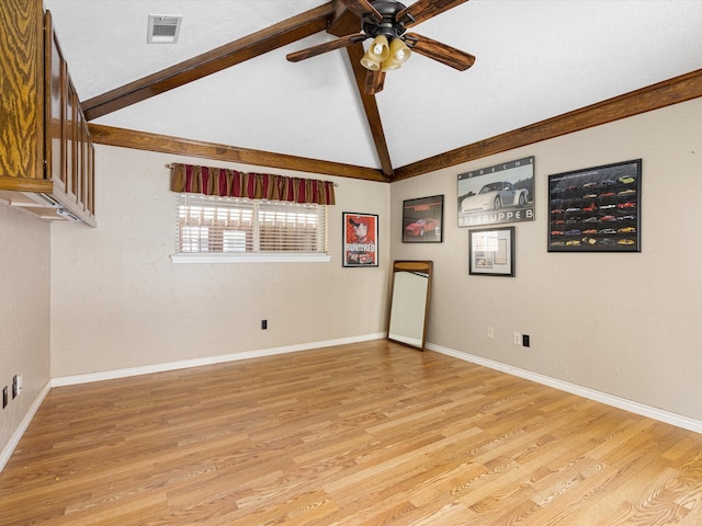 unfurnished room with lofted ceiling, light hardwood / wood-style floors, and ceiling fan