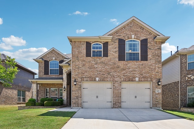 front of property featuring a garage and a front lawn