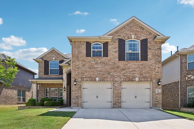 front of property with a garage and a front lawn