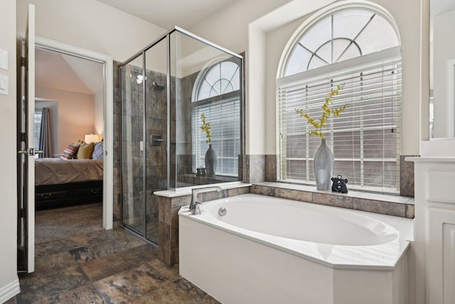 bathroom featuring tile patterned floors and independent shower and bath