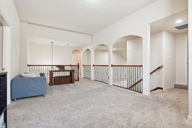 living area with light colored carpet