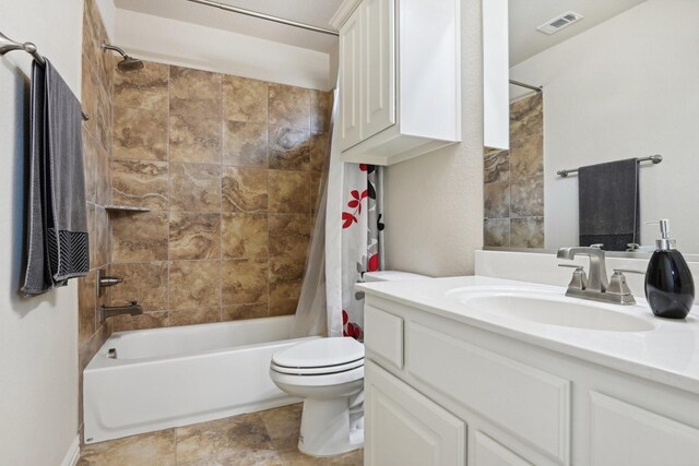 full bathroom with shower / bathtub combination with curtain, toilet, vanity, and tile patterned flooring