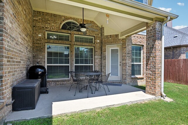 view of patio / terrace with ceiling fan and area for grilling