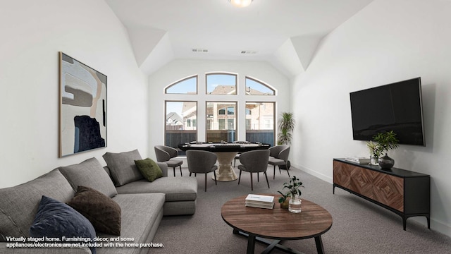 living room featuring vaulted ceiling and carpet flooring